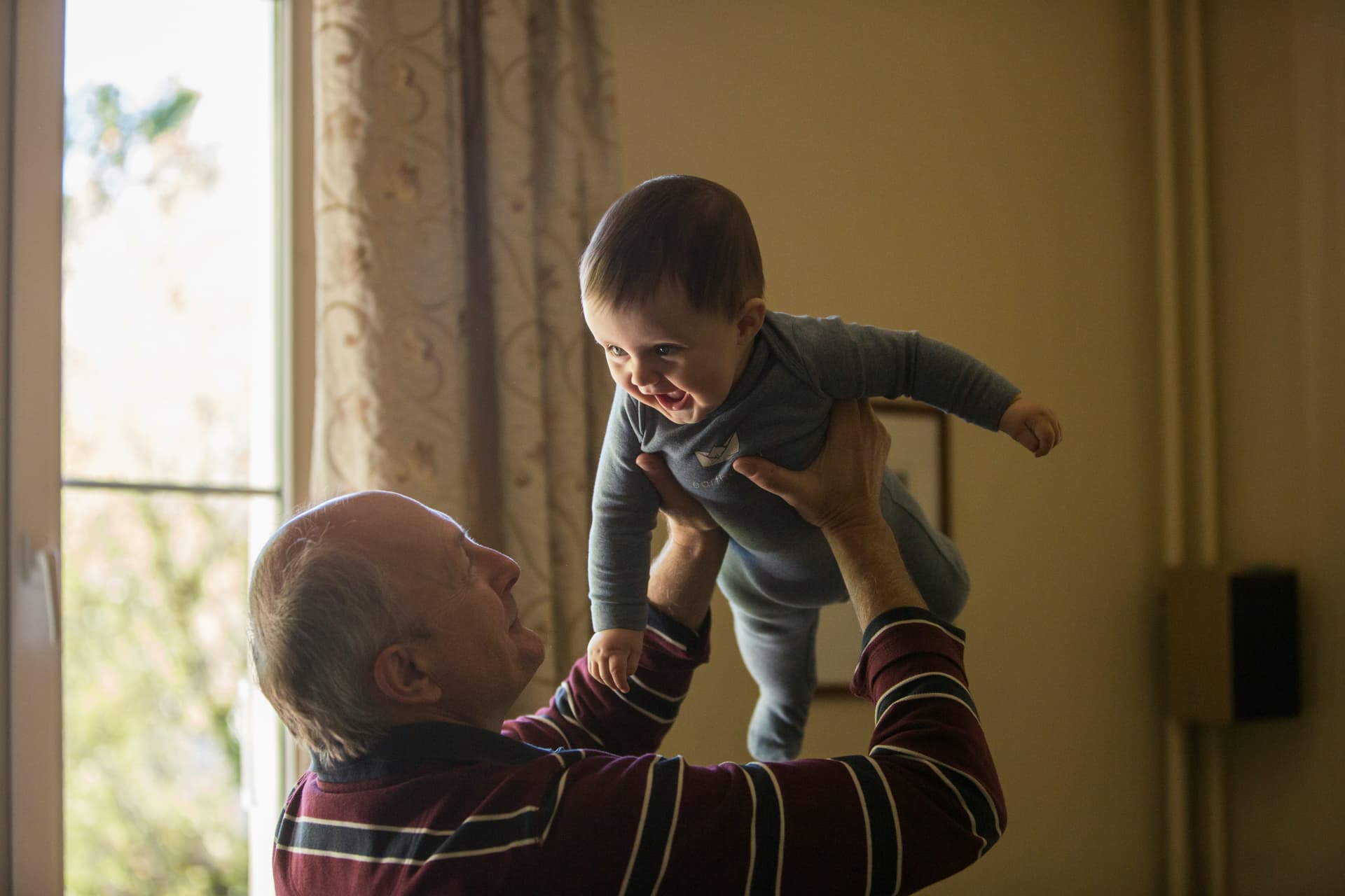 elderly man with baby